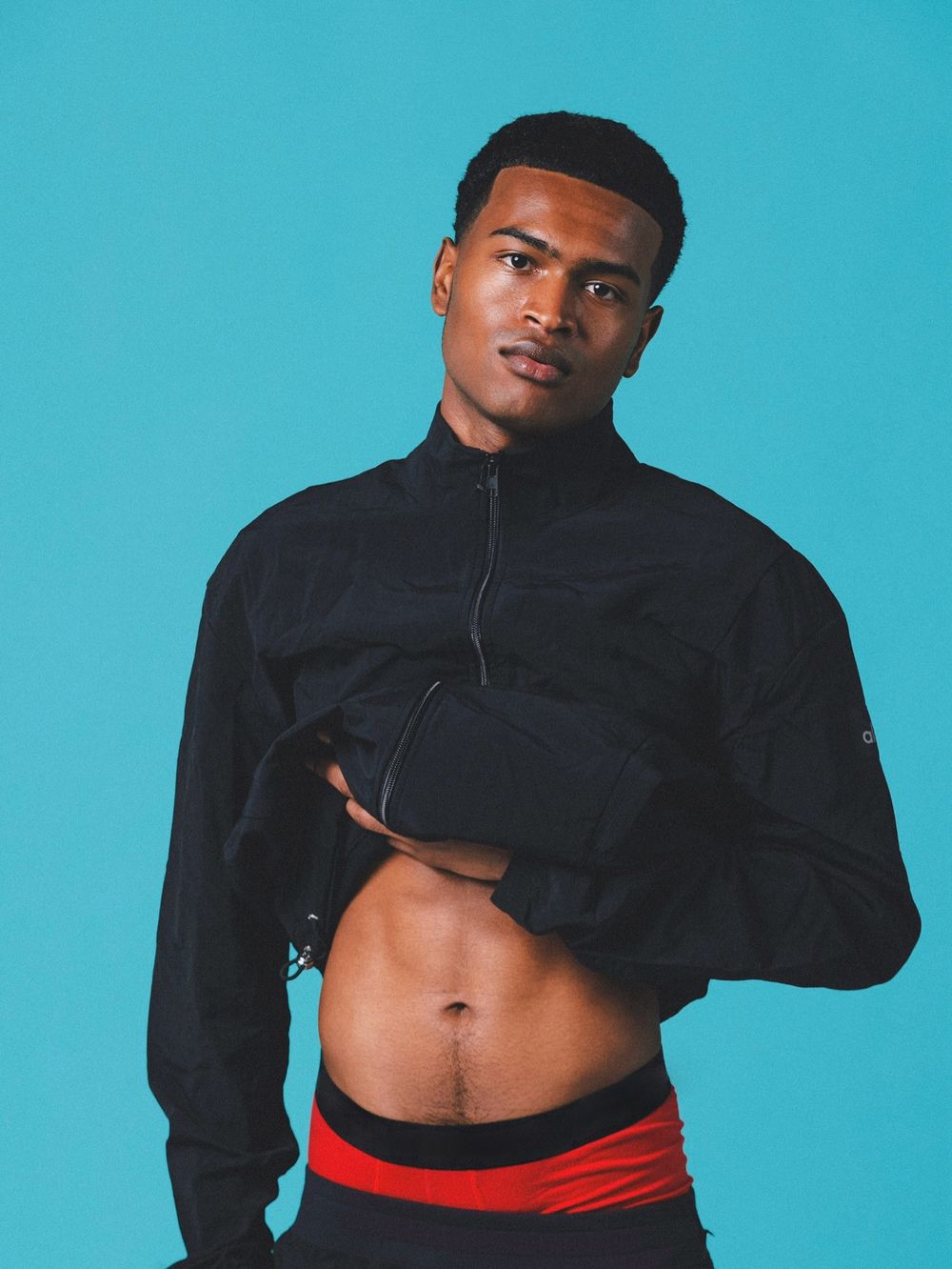 Jayden AJ, full-body studio portrait in a light-blue Burberry set